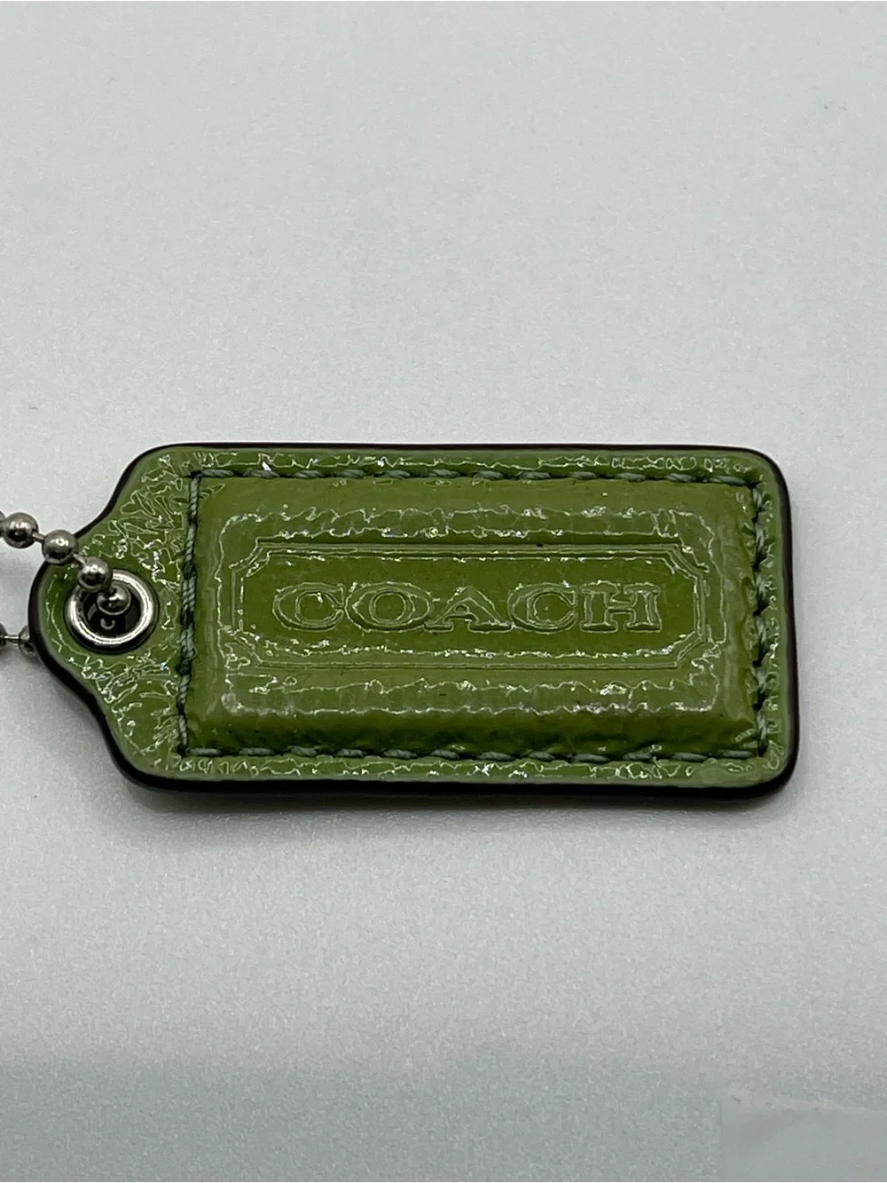 Coach Sage Green Patent Leather Hang Tag Keychain with Silver Chain